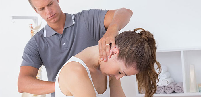 Woman receiving chiropractic adjustment from a Lake Worth chiropractor
