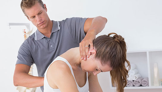 Woman receiving chiropractic adjustment from a Lake Worth chiropractor