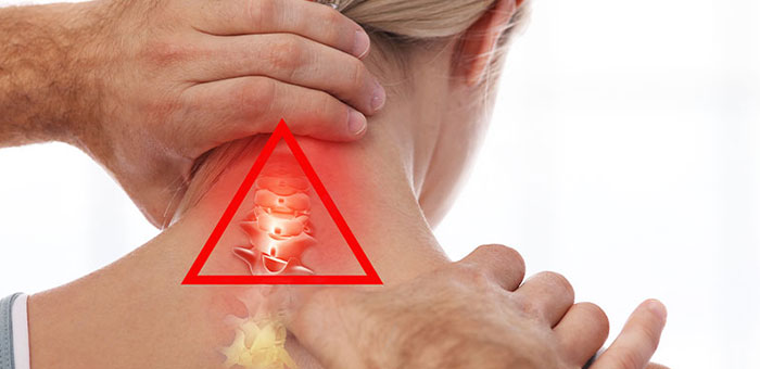 Lake Worth chiropractor adjusting woman's neck for whiplash