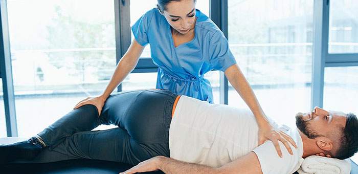 Patient receiving sciatica treatment from Lake Worth chiropractor